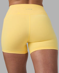 Woman wearing Fusion Ultra High-Rise 4" Short Pockets - Lemon | Model:Sophie | Size:S | Thumbnail Index: 7