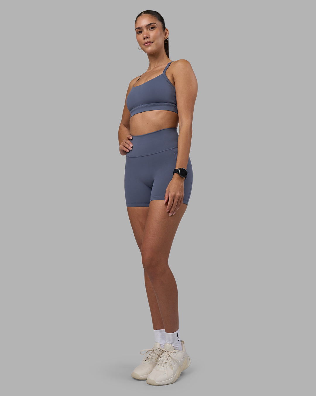 Woman wearing Fusion Ultra High-Rise 4" Short Pockets - Night Shadow | Model:Rhiley | Size:S - view 5