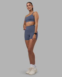 Woman wearing Fusion Ultra High-Rise 4" Short Pockets - Night Shadow | Model:Rhiley | Size:S | Thumbnail Index: 4