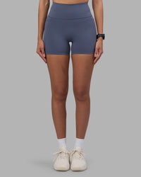 Woman wearing Fusion Ultra High-Rise 4" Short Pockets - Night Shadow | Set:true | Angle:front | Model:Rhiley | Size:S | Thumbnail Index: 6