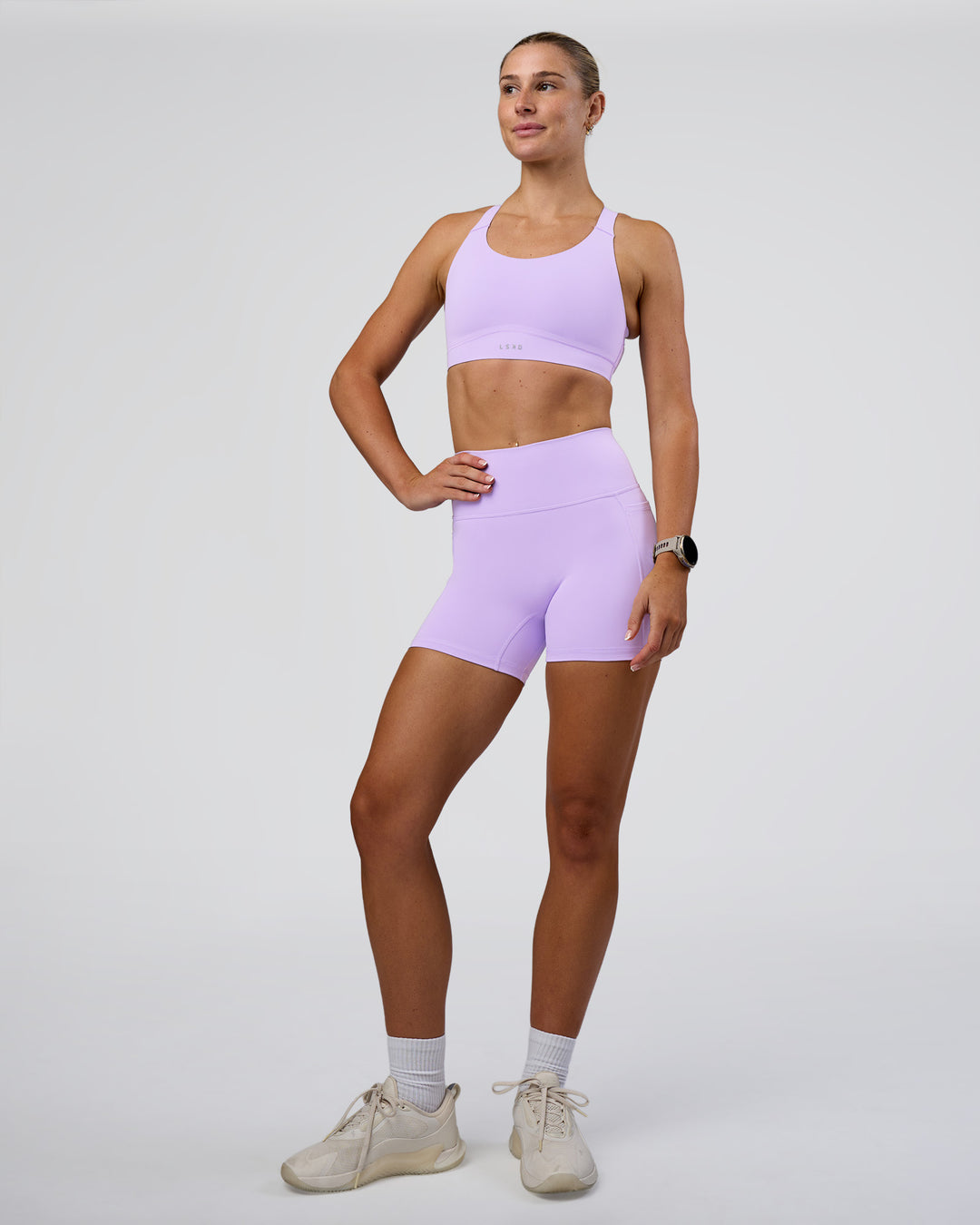 Woman wearing Fusion Ultra High-Rise 4" Short Pockets - Pale Lilac | Model:Emelia | Size:S - view 3
