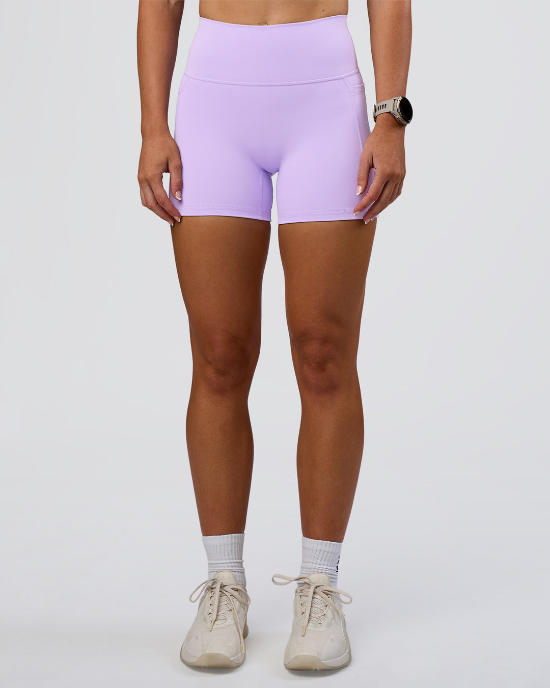 Woman wearing Fusion Ultra High-Rise 4" Short Pockets - Pale Lilac | Model:Emelia | Size:S - view 1
