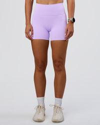 Woman wearing Fusion Ultra High-Rise 4" Short Pockets - Pale Lilac | Model:Emelia | Size:S | Thumbnail Index: 0