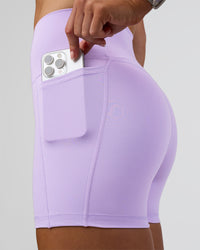 Woman wearing Fusion Ultra High-Rise 4" Short Pockets - Pale Lilac | Model:Emelia | Size:S | Thumbnail Index: 1