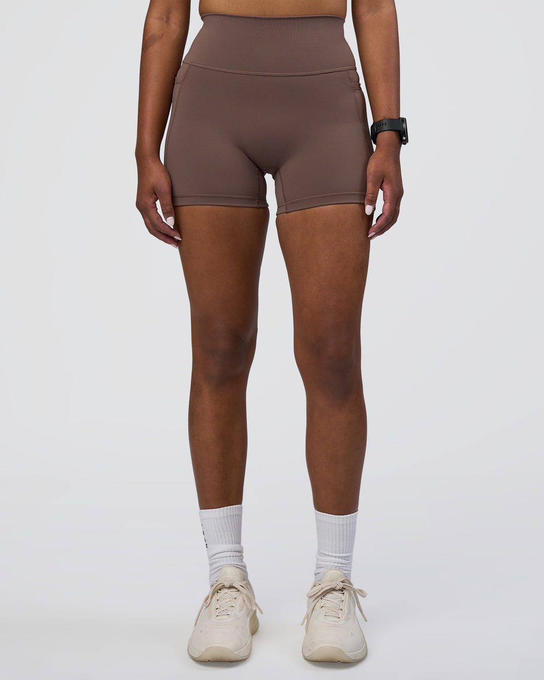 Woman wearing Fusion Ultra High-Rise 4" Short Pockets - Peppercorn | Set:true | Angle:front | Model:Rica | Size:S - view 7