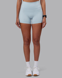 Woman wearing Fusion Ultra High-Rise 4" Short Pockets - Skyride | Model:Rhiley | Size:S | Thumbnail Index: 0