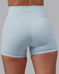 Woman wearing Fusion Ultra High-Rise 4" Short Pockets - Skyride | Model:Rhiley | Size:S | Thumbnail Index: 7