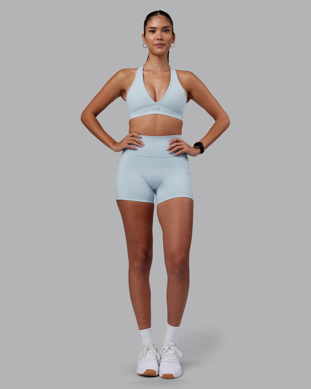 Woman wearing Fusion Ultra High-Rise 4" Short Pockets - Skyride | Model:Rhiley | Size:S - view 5