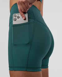 Woman wearing Fusion Ultra High-Rise 4" Short Pockets - Transformative Teal | Set:true | Angle:closeup | Model:Myrte | Size:S | Thumbnail Index: 2