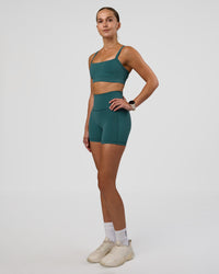 Woman wearing Fusion Ultra High-Rise 4" Short Pockets - Transformative Teal | Model:Myrte | Size:S | Thumbnail Index: 4