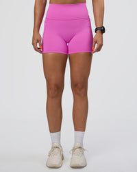 Woman wearing Fusion Ultra High-Rise 4" Short Pockets - Ultra Fuchsia | Set:true | Angle:front | Model:Abbey | Size:S | Thumbnail Index: 0