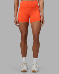 Woman wearing Fusion Ultra High-Rise 4" Short Pockets - Ultra Orange | Set:true | Angle:front | Model:Katie | Size:S | Thumbnail Index: 2