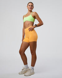 Woman wearing Fusion Ultra High-Rise 4" Short Pockets - Warm Apricot | Model:Emelia | Size:S | Thumbnail Index: 5