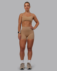 Woman wearing Fusion Ultra High-Rise 4" Short Pockets - Warm Smoke | Model:Lyss | Size:S | Thumbnail Index: 0