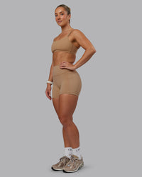 Woman wearing Fusion Ultra High-Rise 4" Short Pockets - Warm Smoke | Model:Lyss | Size:S | Thumbnail Index: 4