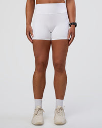 Woman wearing Fusion Ultra High-Rise 4" Short Pockets - White | Set:true | Angle:front | Model:Sav | Size:S | Thumbnail Index: 6