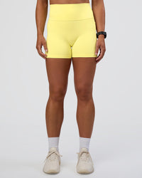 Woman wearing Fusion Ultra High-Rise 4" Short Pockets - Yellow Fizz | Set:true | Angle:front | Model:Sav | Size:S | Thumbnail Index: 6