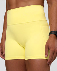 Woman wearing Fusion Ultra High-Rise 4" Short Pockets - Yellow Fizz | Model:Sav | Size:S | Thumbnail Index: 5