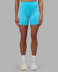Woman wearing Fusion Ultra High-Rise 6" Short - Blue Atoll | Set:true | Angle:front | Model:Katie | Size:S | Thumbnail Index: 5