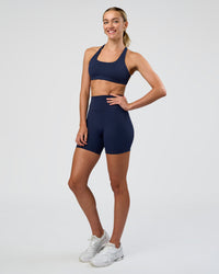 Woman wearing Fusion Ultra High-Rise 6" Short - Future Navy | Model:Evie | Size:S | Thumbnail Index: 1