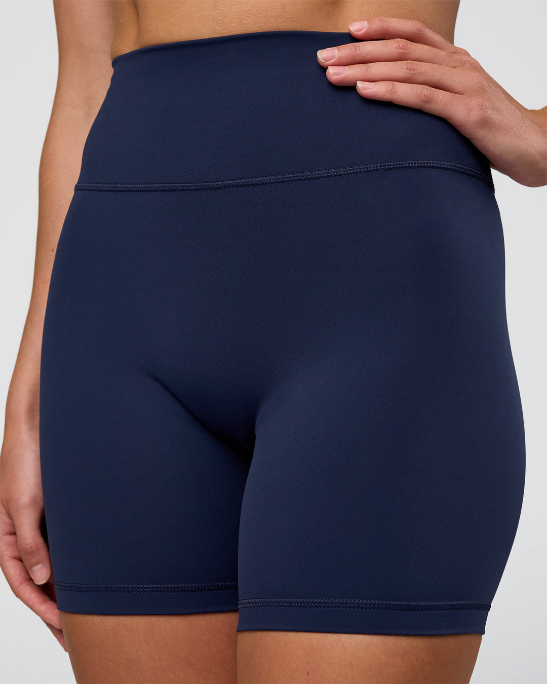 Woman wearing Fusion Ultra High-Rise 6" Short - Future Navy | Set:true | Angle:closeup | Model:Evie | Size:S - view 1