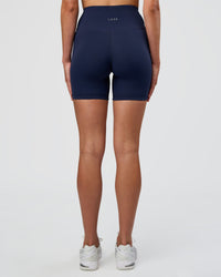 Woman wearing Fusion Ultra High-Rise 6" Short - Future Navy | Set:true | Angle:back | Model:Evie | Size:S | Thumbnail Index: 3