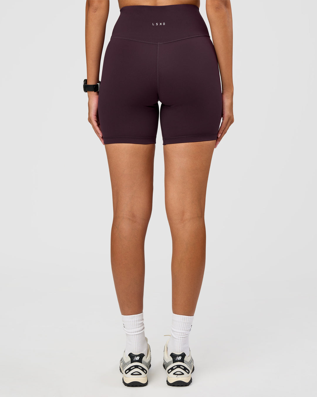 Woman wearing Fusion Ultra High-Rise 6" Short - Midnight Plum | Set:true | Angle:back | Model:Rhiley | Size:S - view 5