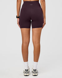 Woman wearing Fusion Ultra High-Rise 6" Short - Midnight Plum | Set:true | Angle:back | Model:Rhiley | Size:S | Thumbnail Index: 4