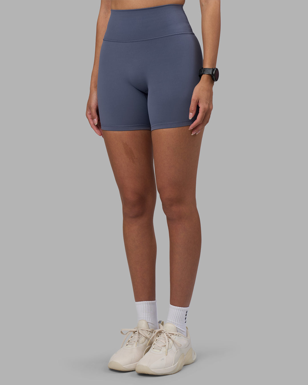 Woman wearing Fusion Ultra High-Rise 6" Short - Night Shadow | Set:true | Angle:side | Model:Rhiley | Size:S - view 7