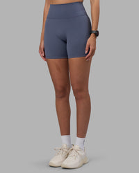 Woman wearing Fusion Ultra High-Rise 6" Short - Night Shadow | Set:true | Angle:side | Model:Rhiley | Size:S | Thumbnail Index: 6