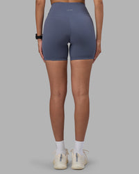 Woman wearing Fusion Ultra High-Rise 6" Short - Night Shadow | Set:true | Angle:back | Model:Rhiley | Size:S | Thumbnail Index: 7