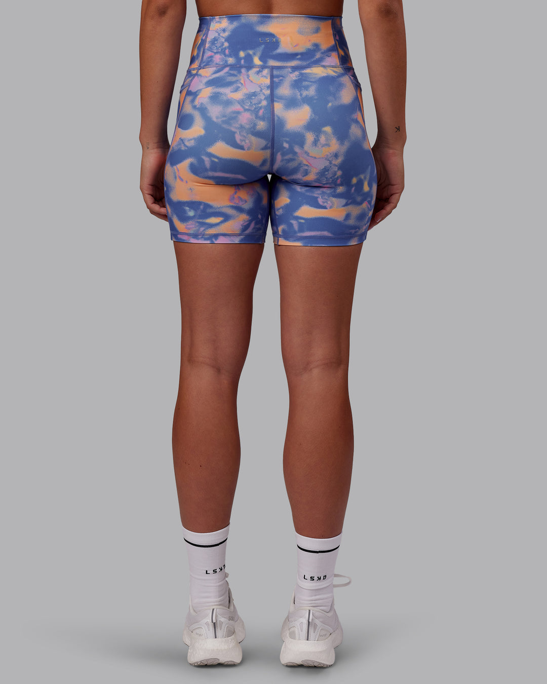 Woman wearing Fusion Ultra High-Rise 6" Short Pockets - Apricot Mist | Set:true | Angle:back | Model:Charlize | Size:S - view 3