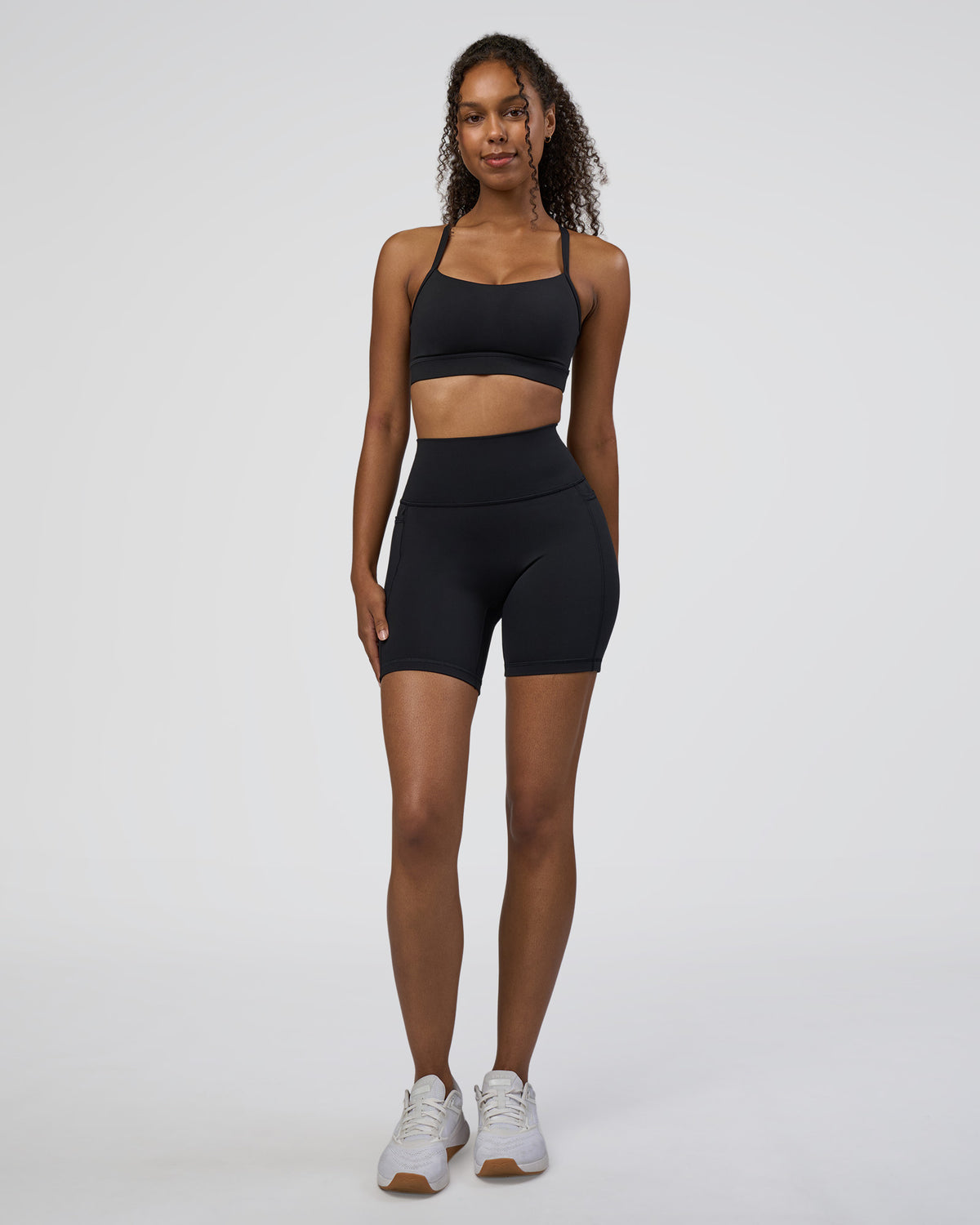 Woman wearing Fusion Ultra High-Rise 6" Short Pockets - Black | Model:Jordan | Size:S