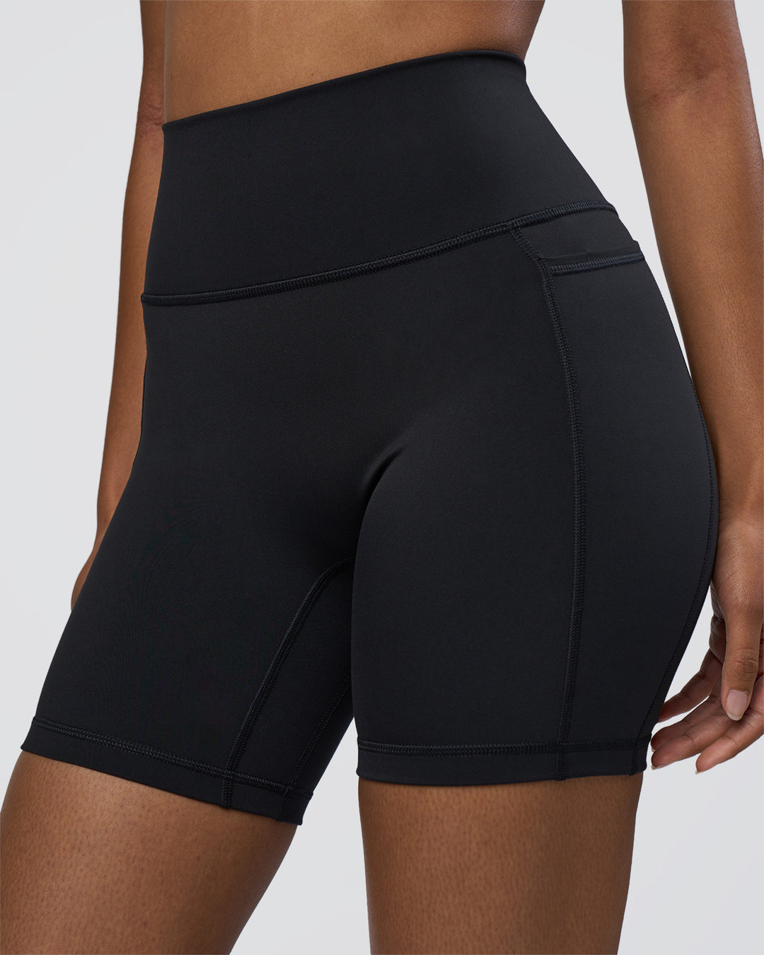 Woman wearing Fusion Ultra High-Rise 6" Short Pockets - Black | Set:true | Angle:closeup | Model:Jordan | Size:S - view 3