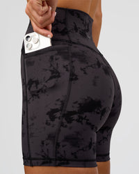 Woman wearing Fusion Ultra High-Rise 6" Short Pockets - Black Tie Dye | Set:true | Angle:closeup | Model:Amity | Size:S | Thumbnail Index: 4