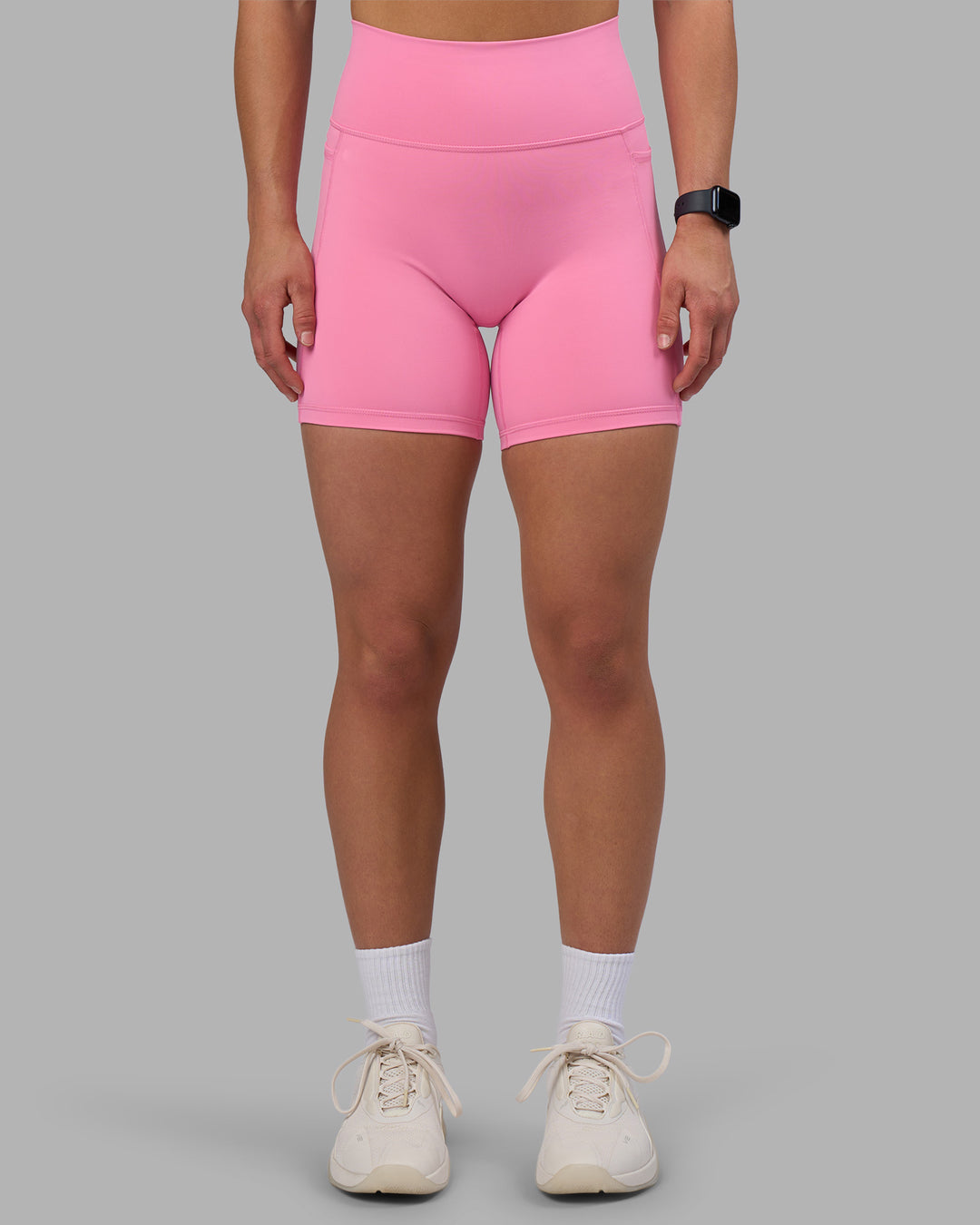 Woman wearing Fusion Ultra High-Rise 6" Short Pockets - Candy Pink | Set:true | Angle:front | Model:Keisha | Size:S - view 1