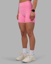 Woman wearing Fusion Ultra High-Rise 6" Short Pockets - Candy Pink | Set:true | Angle:side | Model:Keisha | Size:S | Thumbnail Index: 5