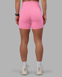 Woman wearing Fusion Ultra High-Rise 6" Short Pockets - Candy Pink | Set:true | Angle:back | Model:Keisha | Size:S | Thumbnail Index: 3