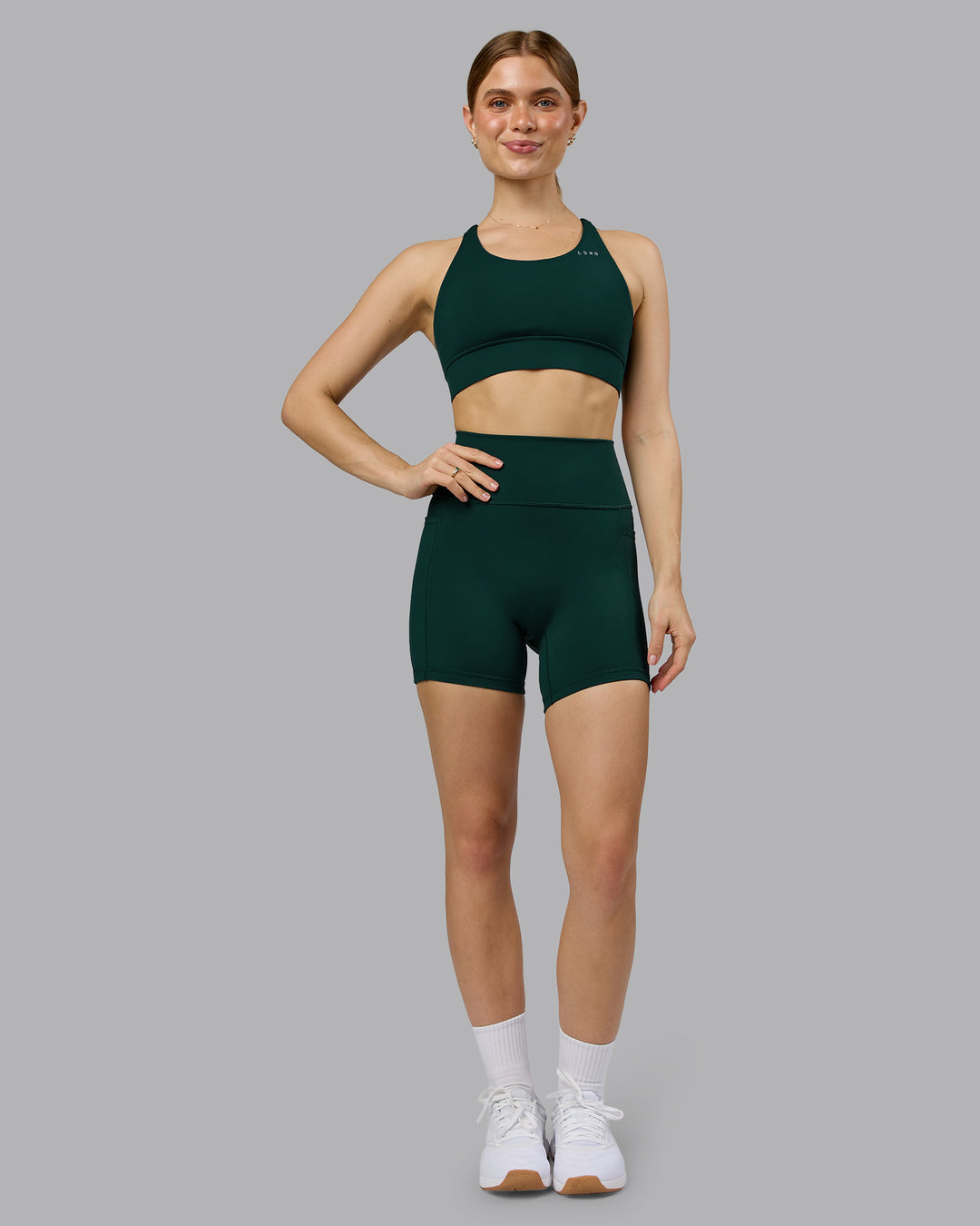 Woman wearing Fusion Ultra High-Rise 6" Short Pockets - Dark Moss | Model:Emilie | Size:S - view 5