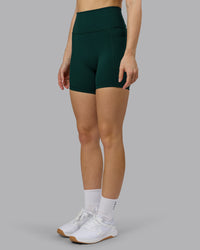 Woman wearing Fusion Ultra High-Rise 6" Short Pockets - Dark Moss | Model:Emilie | Size:S | Thumbnail Index: 5