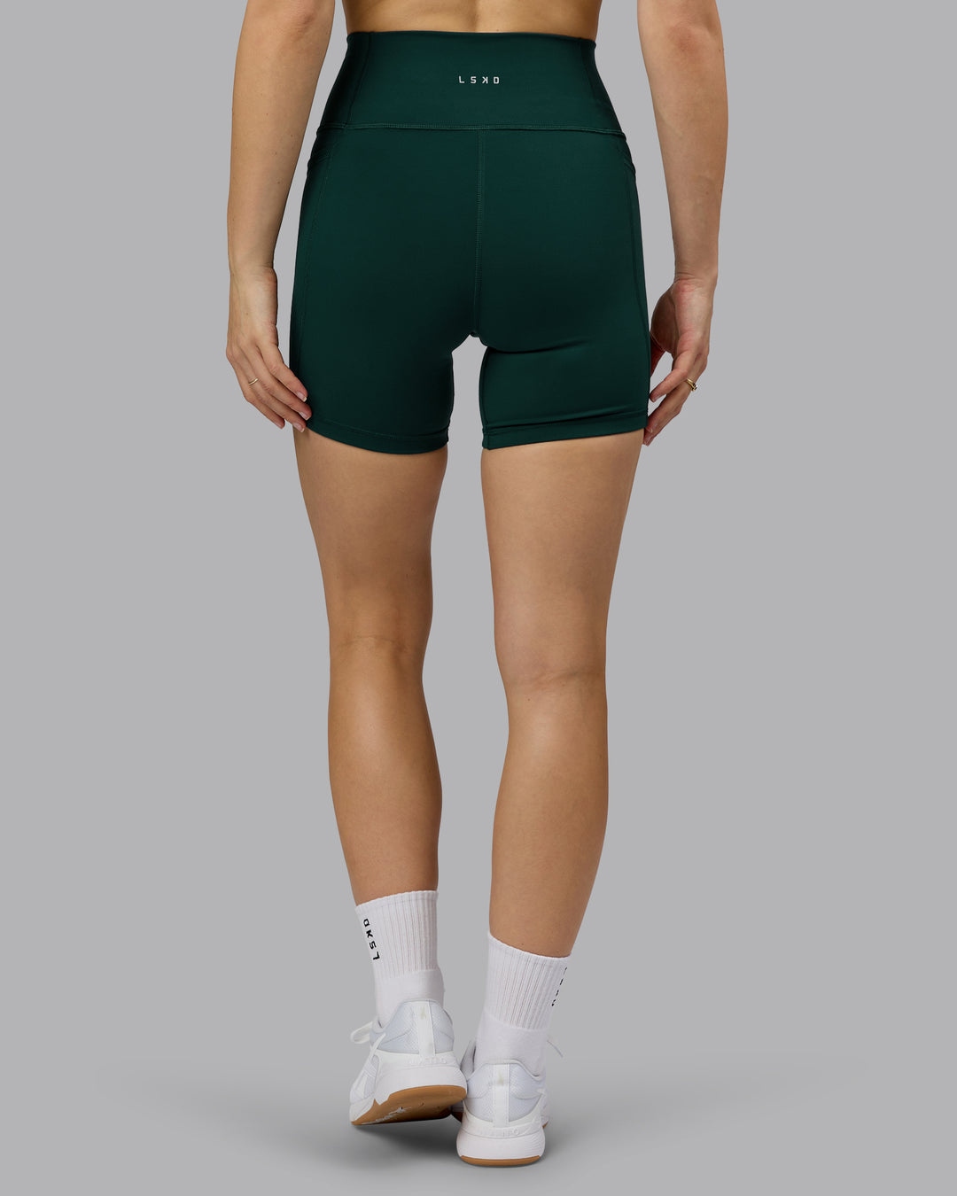 Woman wearing Fusion Ultra High-Rise 6" Short Pockets - Dark Moss | Model:Emilie | Size:S - view 4