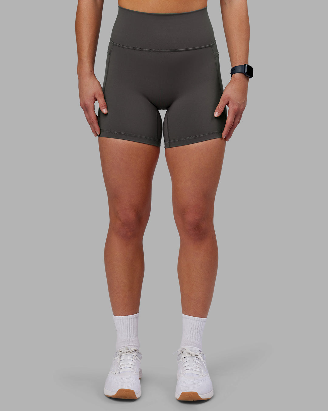 Woman wearing Fusion Ultra High-Rise 6" Short Pockets - Dark Storm | Model:Keisha | Size:S - view 1