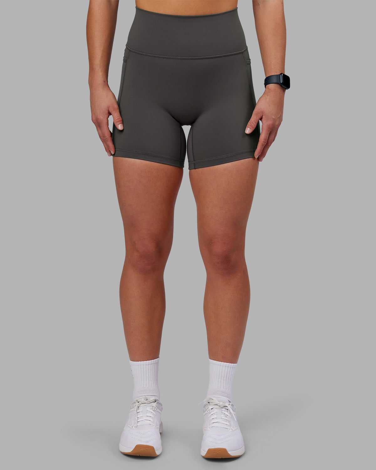 Woman wearing Fusion Ultra High-Rise 6" Short Pockets - Dark Storm | Model:Keisha | Size:S