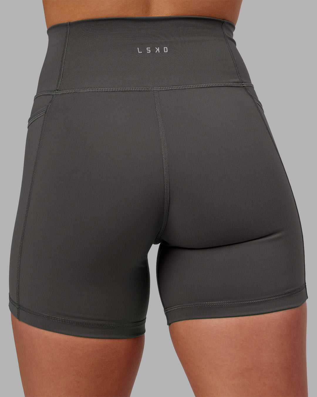 Woman wearing Fusion Ultra High-Rise 6" Short Pockets - Dark Storm | Model:Keisha | Size:S - view 4