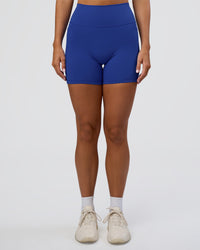 Woman wearing Fusion Ultra High-Rise 6" Short Pockets - Electric Indigo | Set:true | Angle:front | Model:Amity | Size:S | Thumbnail Index: 6