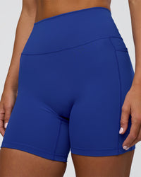 Woman wearing Fusion Ultra High-Rise 6" Short Pockets - Electric Indigo | Model:Amity | Size:S | Thumbnail Index: 5