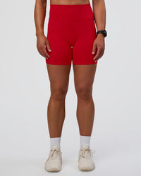 Woman wearing Fusion Ultra High-Rise 6" Short Pockets - Flame | Set:true | Angle:front | Model:Sav | Size:S | Thumbnail Index: 2