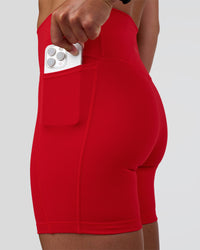 Woman wearing Fusion Ultra High-Rise 6" Short Pockets - Flame | Set:true | Angle:closeup | Model:Sav | Size:S | Thumbnail Index: 1