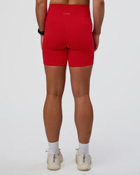 Woman wearing Fusion Ultra High-Rise 6" Short Pockets - Flame | Set:true | Angle:back | Model:Sav | Size:S | Thumbnail Index: 3