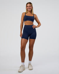 Woman wearing Fusion Ultra High-Rise 6" Short Pockets - Future Navy | Model:Amity | Size:S | Thumbnail Index: 1